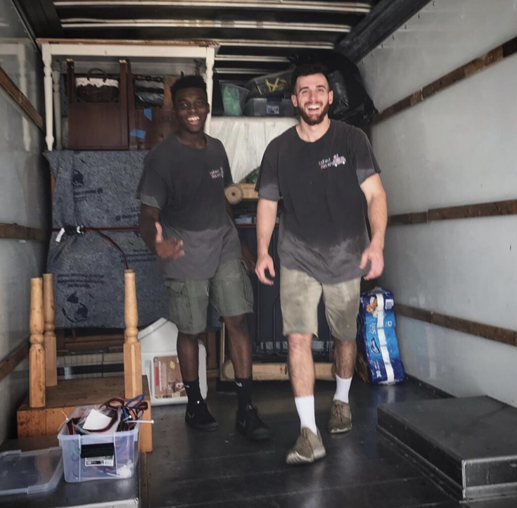 Happy movers after finishing loading the truck